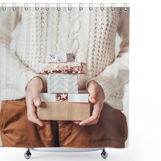 Personality  Woman In Cable-knit White Sweater With Scandinavian Pattern And Brown Chinos Trousers. Stack Of Christmas Presents In Hands. Casual Outfit For New Year Celebration. Shower Curtains