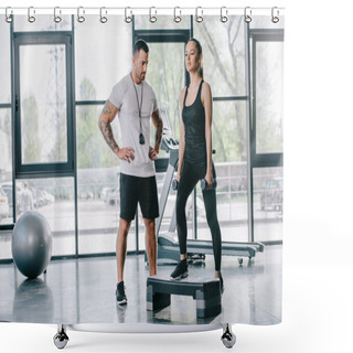 Personality  Male Personal Trainer And Young Sportswoman Doing Step Aerobics Exercise With Dumbbells At Gym Shower Curtains