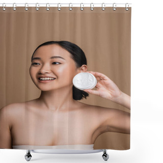 Personality  Cheerful Asian Model In Top Holding Cosmetic Cream Isolated On Brown  Shower Curtains