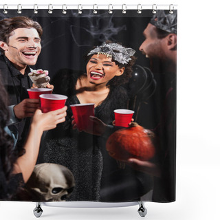 Personality  Excited African American Woman Holding Toy Hand Near Multiethnic Friends Clinking Plastic Cups On Halloween Party On Black Shower Curtains