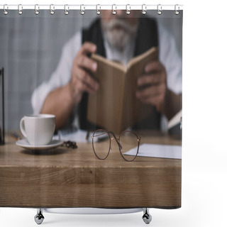 Personality  Senior Man Reading Book At Work Desk With Cup Of Coffee And Eyeglasses On Foreground Shower Curtains