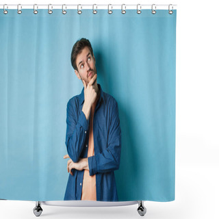 Personality  Pensive Young Man Touching Face And Looking Aside At Empty Space, Imaging Something, Thinking Off Plan, Standing On Blue Background Shower Curtains