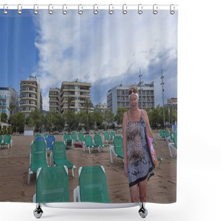 Personality  A Mature Woman In A Swimsuit, Turning A Pareo, On A Large Sandy Beach. Nearby There Are Plenty Of Free Sun Loungers, Behind The Building Of Unidentified Hotels Shower Curtains
