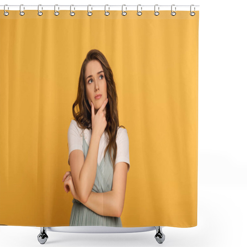 Personality  thoughtful spring woman with long hair isolated on yellow shower curtains