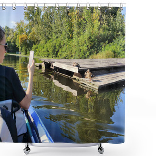 Personality  A Young Woman Floats Down A River In A Boat And Takes Pictures Of Wild Ducks On A Dock On Her Mobile Phone. Active Recreation And Nature Shower Curtains