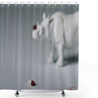 Personality  Selective Focus Of Horn With Blood And Toy Rhinoceros On Grey Background, Hunting For Horn Concept Shower Curtains
