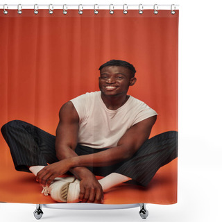 Personality  Young African American Male Model In White Tank Top And Pants Sitting An Smiling At Camera On Red Shower Curtains