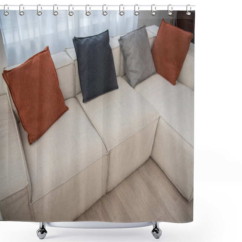 Personality  High angle view of couch with multicolor pillows  shower curtains