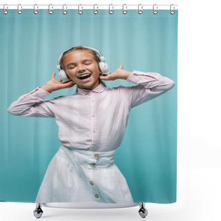 Personality  Positive Schoolgirl Listening Music In Headphones Isolated On Blue  Shower Curtains