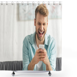 Personality  Selective Focus Of Cheerful Man Laughing While Using Smartphone On Couch  Shower Curtains
