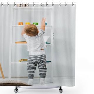 Personality  Cute Toddler Boy Standing Near Rack And Reaching For Toys On Shelves Shower Curtains