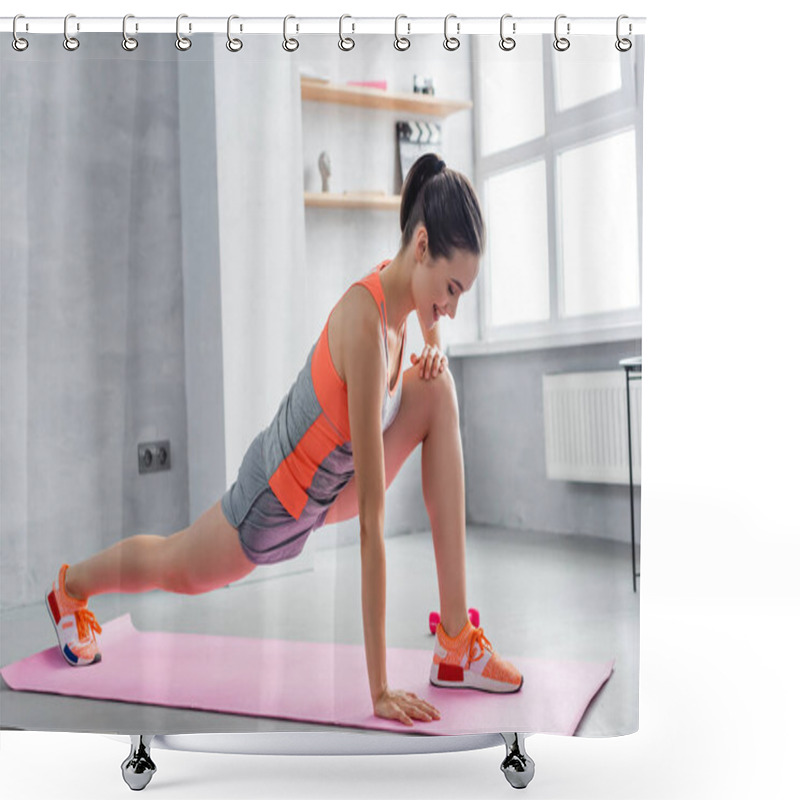 Personality  Sportswoman doing lunge on fitness mat at home shower curtains