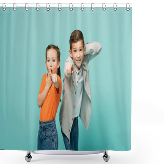 Personality  Shocked Girl In Orange T-shirt Covering Mouth Near Boy Pointing At Camera Isolated On Blue Shower Curtains