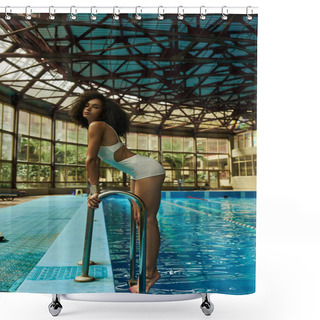 Personality  Young And Curly African American Woman In Bathing Suit Standing By Pool Ladder With Blue Water Shower Curtains