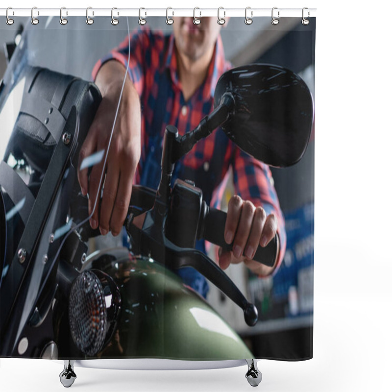 Personality  cropped view of mechanic checking brake handle of motorcycle on blurred background shower curtains