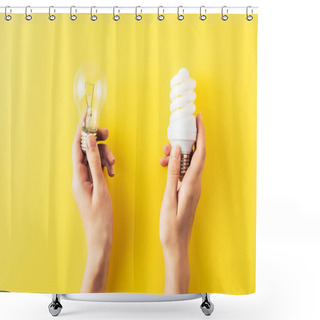 Personality  Cropped Shot Of Person Holding Different Types Of Light Bulbs On Yellow Shower Curtains