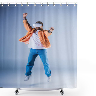 Personality  A Man, Wearing A VR Headset, Joyfully Leaps In The Air Within A Studio Setting, Headphones On. Shower Curtains
