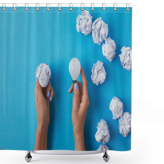 Personality  Cropped Shot Of Woman Holding Energy Saving Light Bulb With Crumpled Paper Over Blue Surface Shower Curtains