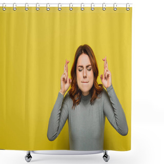 Personality  Worried Woman With Closed Eyes Holding Crossed Fingers While Standing On Yellow Shower Curtains