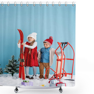 Personality  Girl In Winter Outfit Holding Skis Near Boy Standing Near Sleight And Presents On Snow Isolated On Blue  Shower Curtains