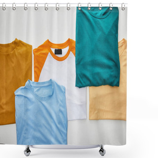 Personality  Top View Of Beige, Orange, Blue, Turquoise And Ochre Folded T-shirts On White Background Shower Curtains