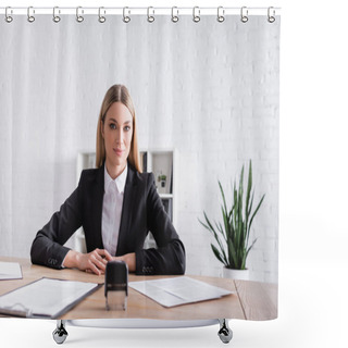 Personality  Positive Notary Looking At Camera Near Documents And Stamper On Blurred Foreground Shower Curtains