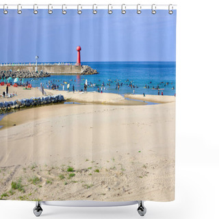 Personality  Yangyang County, South Korea - July 30th, 2019: A Bustling Summer Day At Gisamun Beach, Featuring A Breakwater That Extends Into The East Sea, Capped By A Red Lighthouse, With Crowds And Surfboards Dotting The Water. Shower Curtains