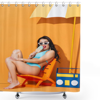 Personality  Trendy Woman In Sunglasses And Swimwear Sitting On Deck Chair Near Paper Boombox And Umbrella While Licking Ice Cream On Orange Shower Curtains