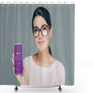 Personality  Portrait Of Smiling Woman In Eyeglasses Showing Smartphone With Instagram App On Screen Isolated On Grey Shower Curtains