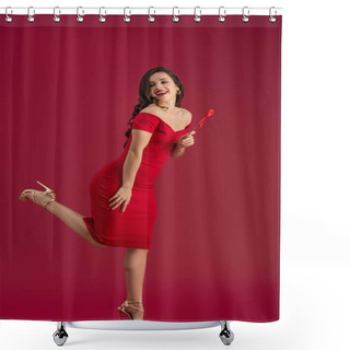 Personality  Happy, Elegant Girl Holding Toy Heart On Stick While Standing On One Leg And Looking Away On Red Background Shower Curtains