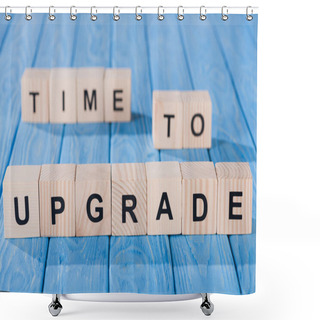 Personality  Close Up View Of Arranged Wooden Blocks Into Time To Upgrade Phrase On Blue Wooden Surface  Shower Curtains
