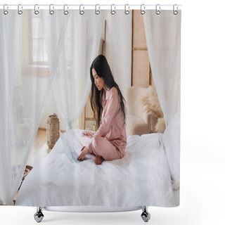 Personality  Young Asian Woman Sitting On Bed With Crossed Legs And Typing On Laptop In Modern Bedroom Shower Curtains