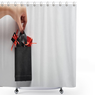 Personality  Cropped View Of Woman Holding Small Black Shopping Bag With Decorative Gift Boxes On White Background Shower Curtains