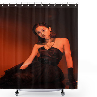 Personality  Beautiful Asian Woman With Short Hair And Wet Hairstyle Posing In Strapless Dress With Tulle Skirt And Gloves While Standing On Orange Background With Red Lighting, Young Model, Looking At Camera  Shower Curtains