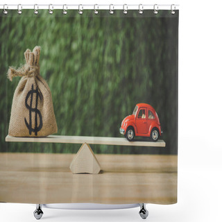 Personality  Toy Car And Money Bag With Dollar Sign Balancing On Seesaw On Green Background Shower Curtains