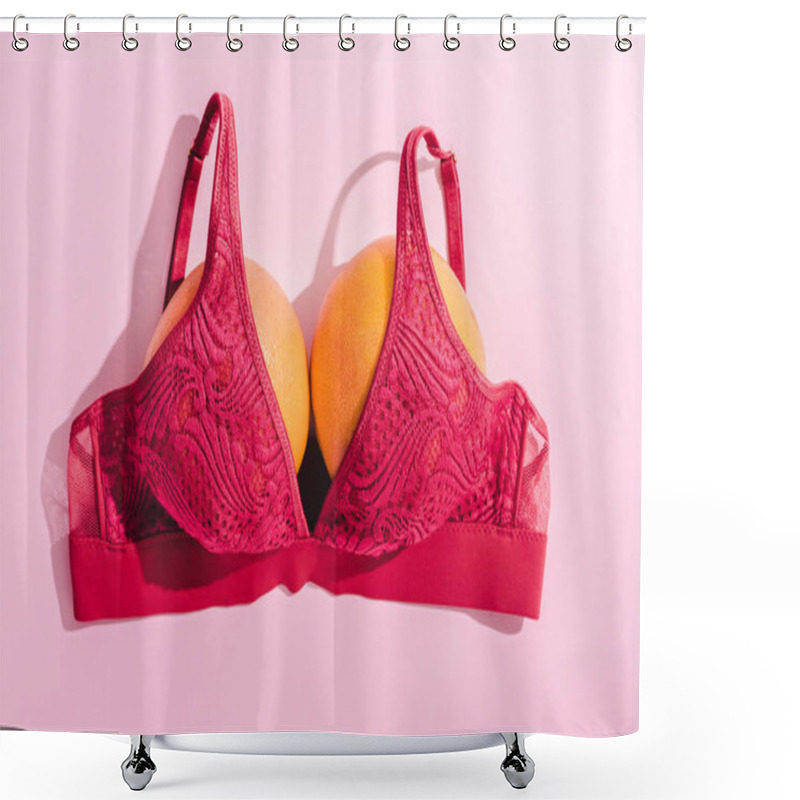 Personality  top view of bra with two oranges on pink, breasts concept shower curtains