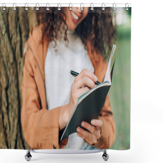 Personality  Cropped View Of Young Woman Writing On Notebook Near Tree In Park  Shower Curtains