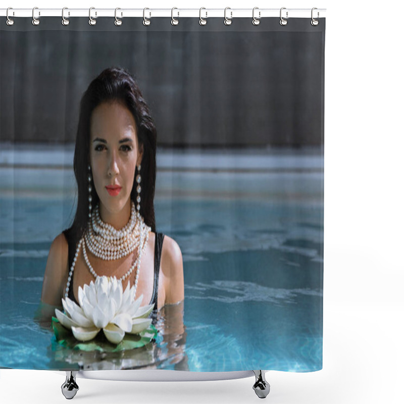 Personality  attractive woman in pearl necklace posing in pool with lotus  shower curtains