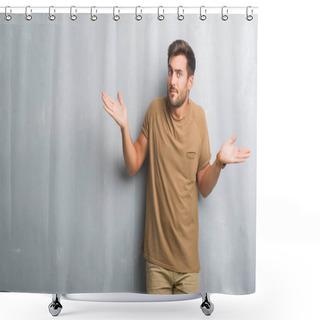 Personality  Handsome Young Man Over Grey Grunge Wall Clueless And Confused Expression With Arms And Hands Raised. Doubt Concept. Shower Curtains