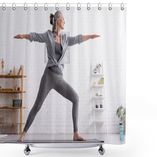Personality  Middle Aged Woman In Sportwear Standing In Warrior Pose While Practicing Yoga At Home  Shower Curtains