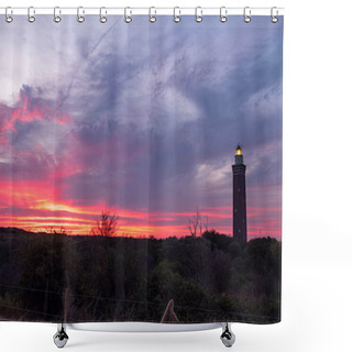 Personality  This Striking Image Captures The Silhouette Of A Towering Lighthouse Set Against The Fiery Canvas Of The Sky At Twilight. Vivid Streaks Of Red And Pink Cut Through The Blue Of The Evening, As The Shower Curtains