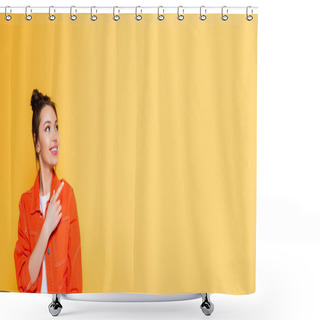 Personality  Panoramic Shot Of Attractive Smiling Woman Looking Away And Pointing With Finger Isolated On Yellow Shower Curtains