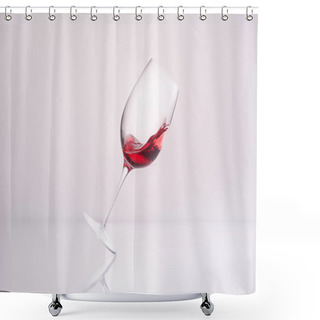Personality  Inclined Glass With Splashing Red Wine On Reflective Surface And On White Shower Curtains