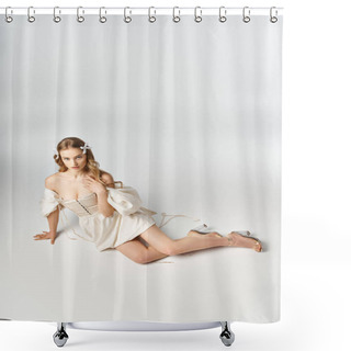 Personality  A Young Blonde Woman Wearing A Flowing White Dress Lies Gracefully On The Ground In A Serene And Elegant Pose. Shower Curtains