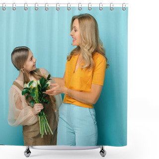 Personality  Cheerful Mother Looking At Daughter With Tulips Isolated On Blue Shower Curtains