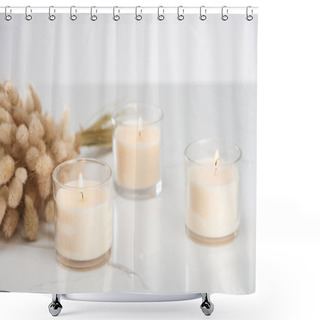 Personality  Selective Focus Of Fluffy Bunny Tail Grass And Burning White Candles In Glass Glowing On Marble White Surface Shower Curtains