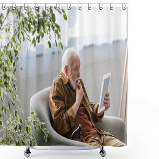 Personality  Shocked Senior Man Using Digital Tablet While Sitting In Armchair Shower Curtains
