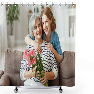 Personality  Cheerful Young Female Smiling And Embracing Happy Senior Mother With Bouquet Of Tulips In Hands While Sitting Together On Sofa In Modern Apartmen Shower Curtains