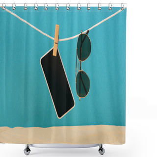 Personality  Smartphone With Blank Screen And Sunglasses Hanging On Rope With Pin On Blue Background Shower Curtains