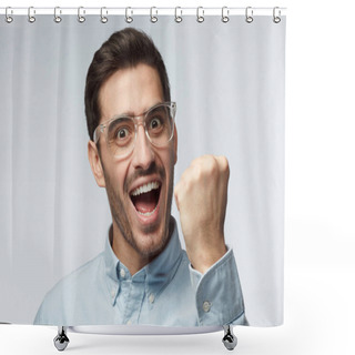 Personality  Studio Portrait Of Young Handsome European Man Pictured Isolated On Gray Background With Transparent Safety Glasses Showing Fist With Positive Face Expression As If Having Achieved His Goal Shower Curtains